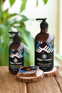 Group of Elija’s Nature body wash bottles with a Black Soap Bar in a bathroom