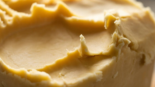 Close-up of a creamy shea butter with a smooth texture.