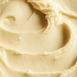 #scent_Mango Papaya - Creamy, whipped texture of Mango Papaya shea butter shown in a soft, smooth swirl