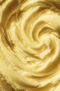 #scent_Lemon Blossom - Swirled yellow-toned shea butter texture, indicating a lemon blossom scent